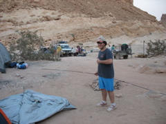 Phil sets up a tent... "And my mom said I couldn't last through a summer of camp. Oh wait."