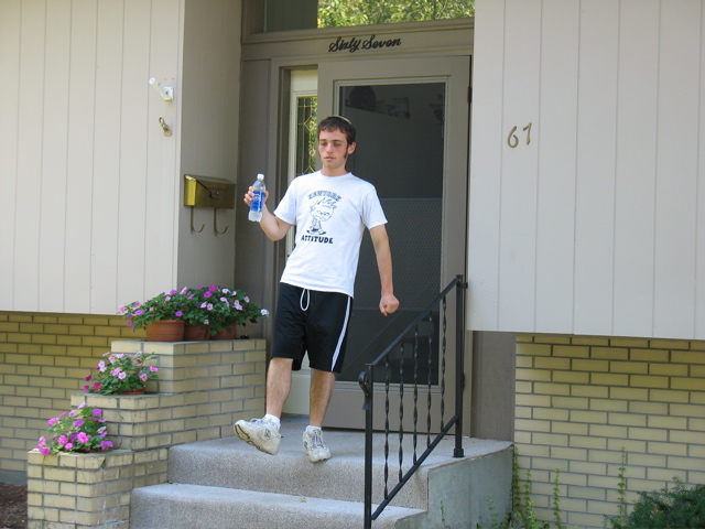 Jacob steps off the porch of Ali's house