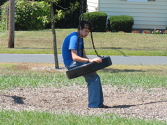 Daniel contemplates a tire swing