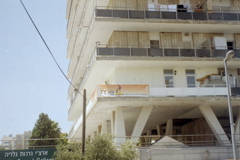 Sign near SuperSol - "Ask me about Land for Peace" [With image of Indian]