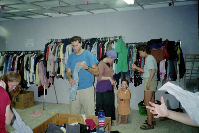 Organizing Clothes in a Secondhand store in Yerucham