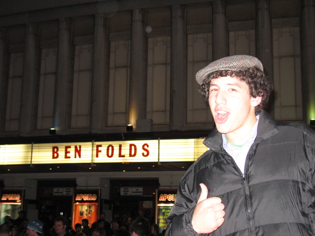 Daniel in front of the sign