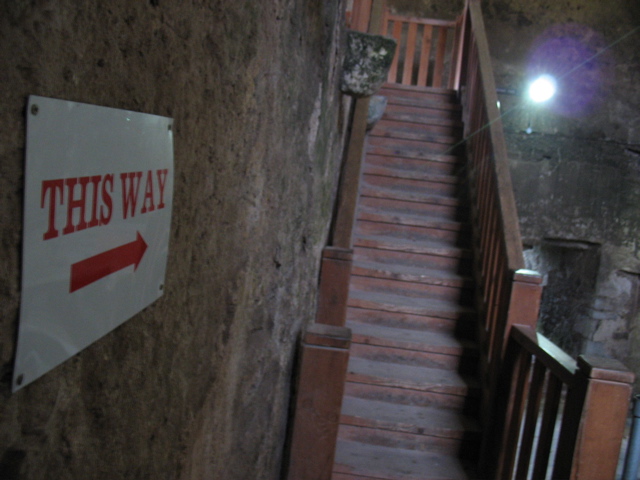 This Way: Up the stairs.