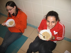 Abi and Shoshana eat the rice happily.