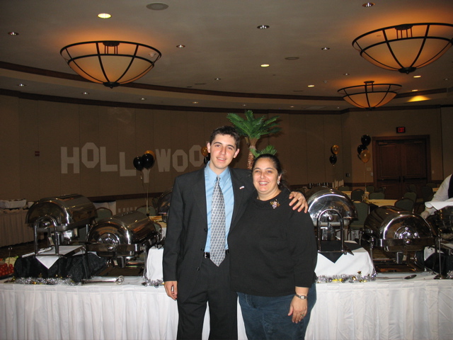 My mom and I, in front of the palm tree in the banquet.