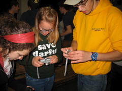 Amy, Rachel, Aaron, taking pictures of shoes